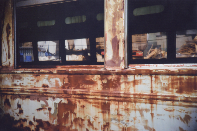 Detail of rusty tram car by camoscrawl